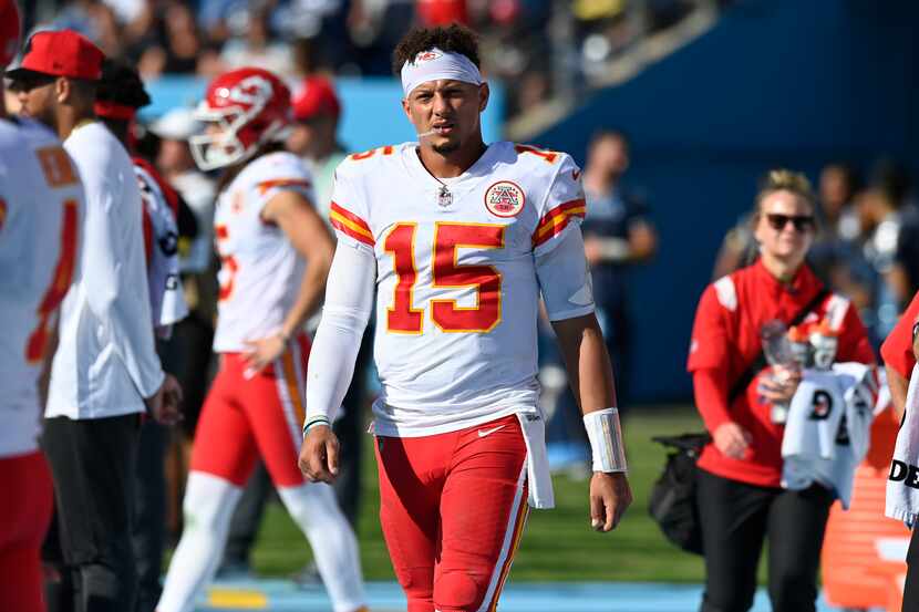 Kansas City Chiefs quarterback Patrick Mahomes (15) walks on the sideline after leaving the...