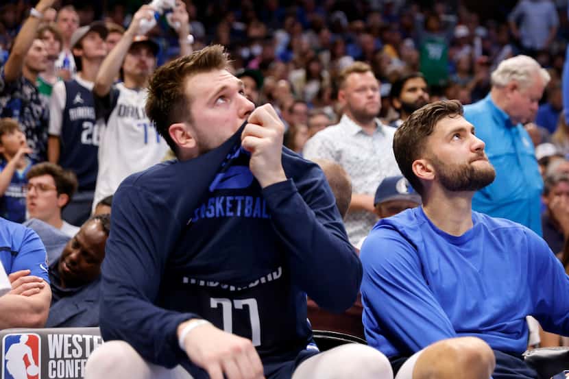 Dallas Mavericks guard Luka Doncic (77) sits on the bench in the third quarter as the team...