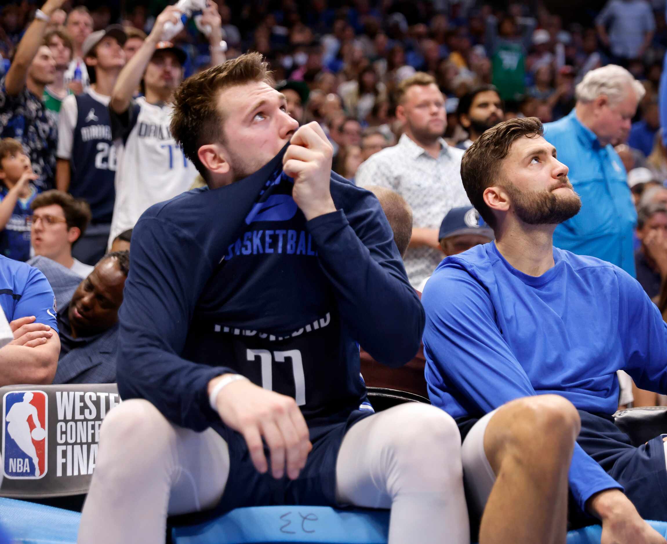 Dallas Mavericks guard Luka Doncic (77) sits on the bench in the third quarter as the team...