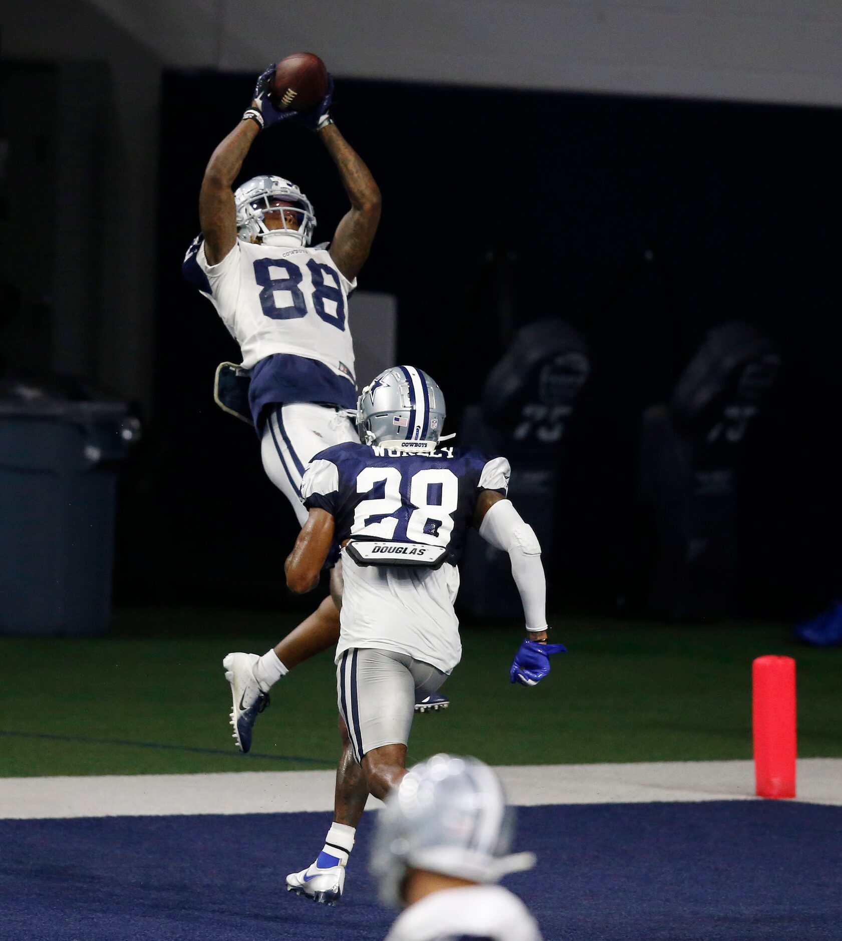 Dallas Cowboys wide receiver CeeDee Lamb (88) leaps for the ball in the end zone in front of...