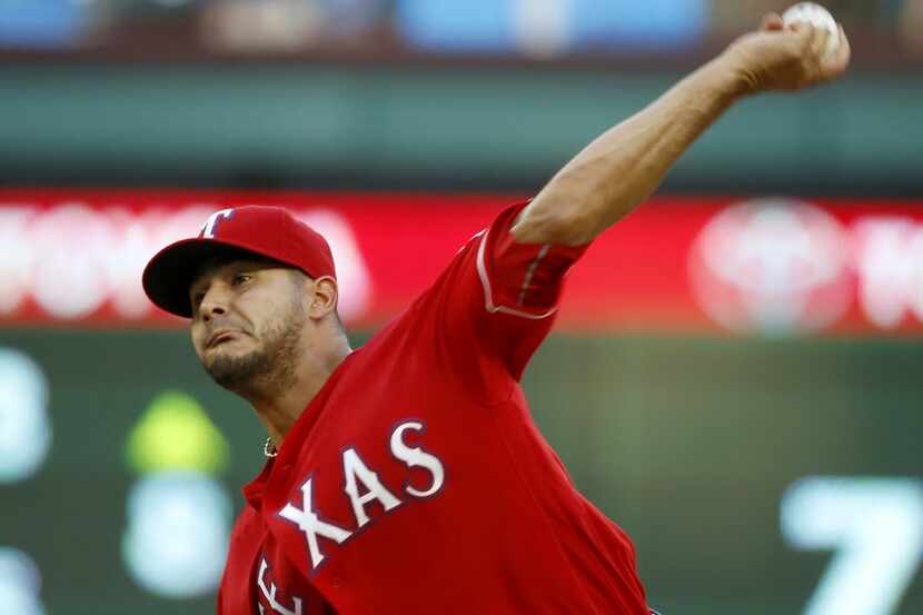Texas Rangers starting pitcher Martin Perez throws a pitch against Kansas City Royals during...