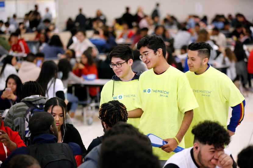 Duncanville High School freshman David Mojica (center) and his friends Isaac Rea (left) and...
