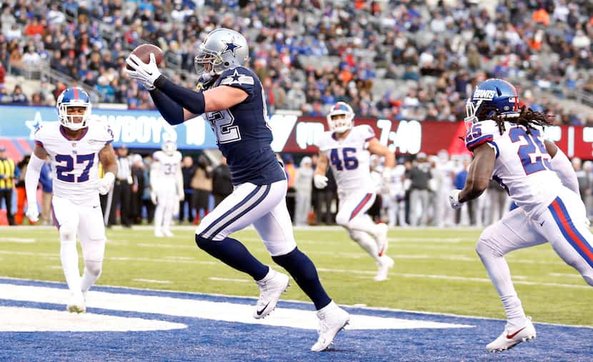 FILE - Cowboys tight end Jason Witten (82) catches a pass for a touchdown in front of New...