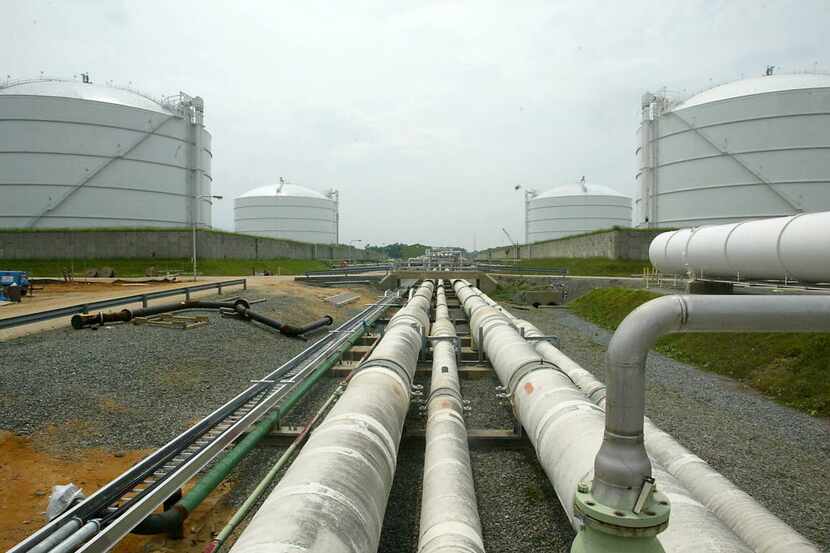FILE - This June 13, 2003 file photo shows pipelines running from the offshore docking...