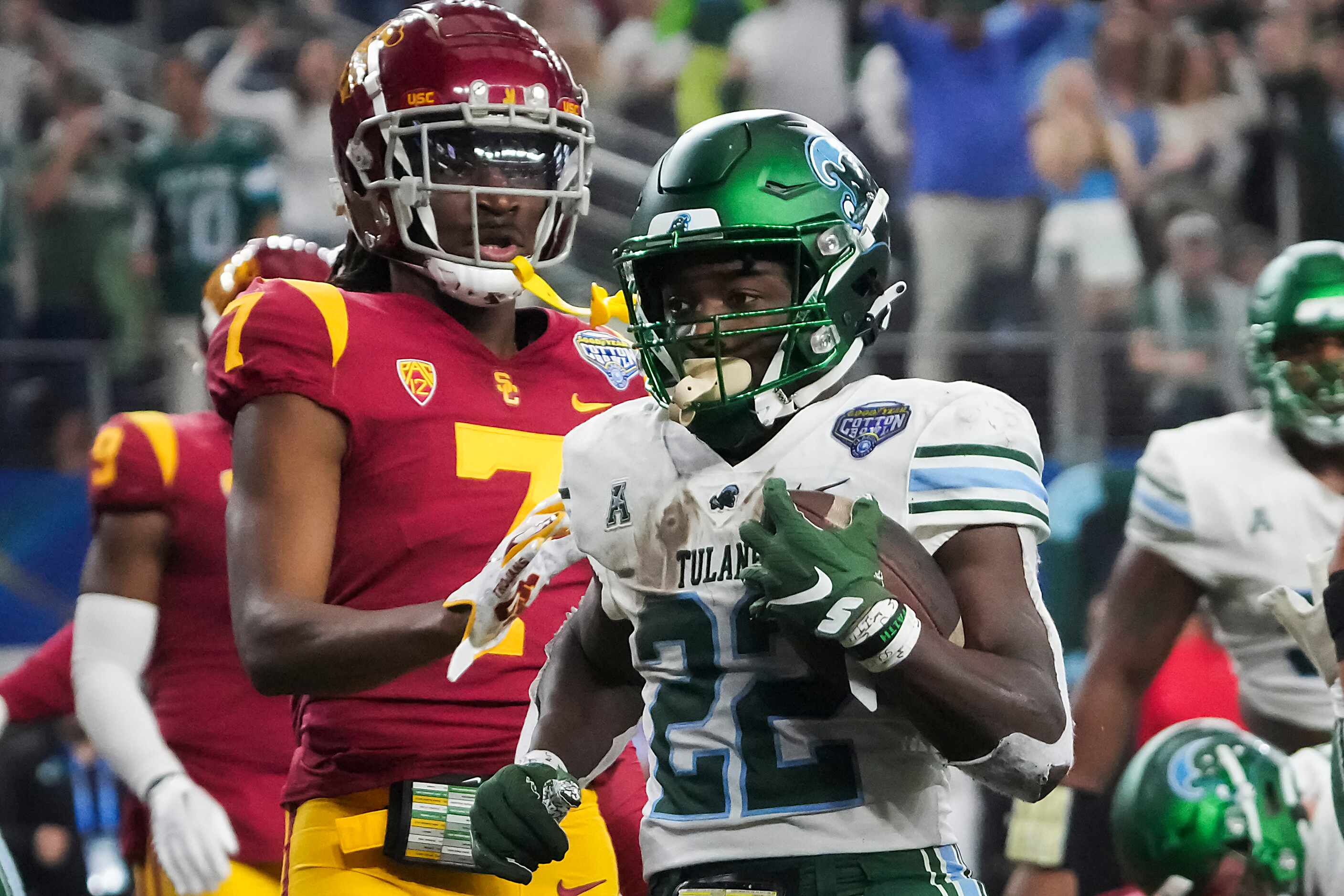Tulane running back Tyjae Spears (22) scores on a touchdown run past USC defensive back...
