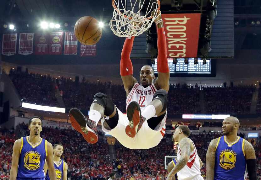 FILE - In this April 24, 2016, file photo, Houston Rockets' Dwight Howard dunks against the...