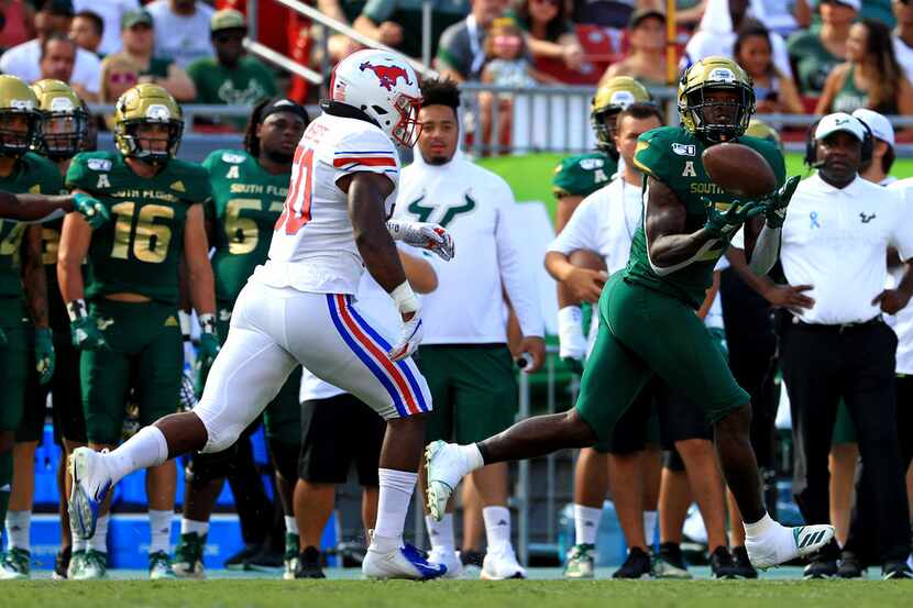 TAMPA, FLORIDA - SEPTEMBER 28: Jordan Cronkrite #2 of the South Florida Bulls makes a catch...