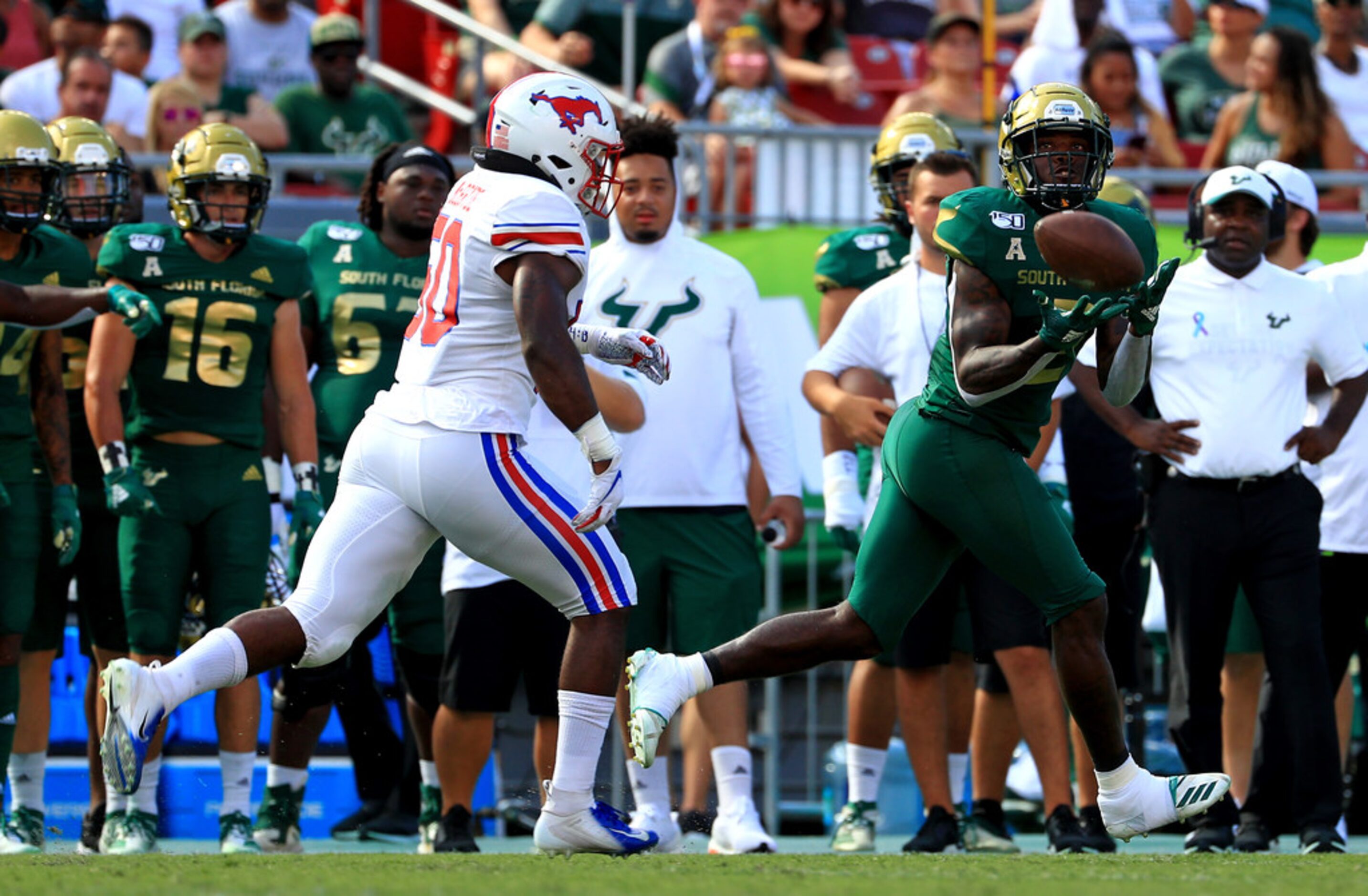 TAMPA, FLORIDA - SEPTEMBER 28: Jordan Cronkrite #2 of the South Florida Bulls makes a catch...