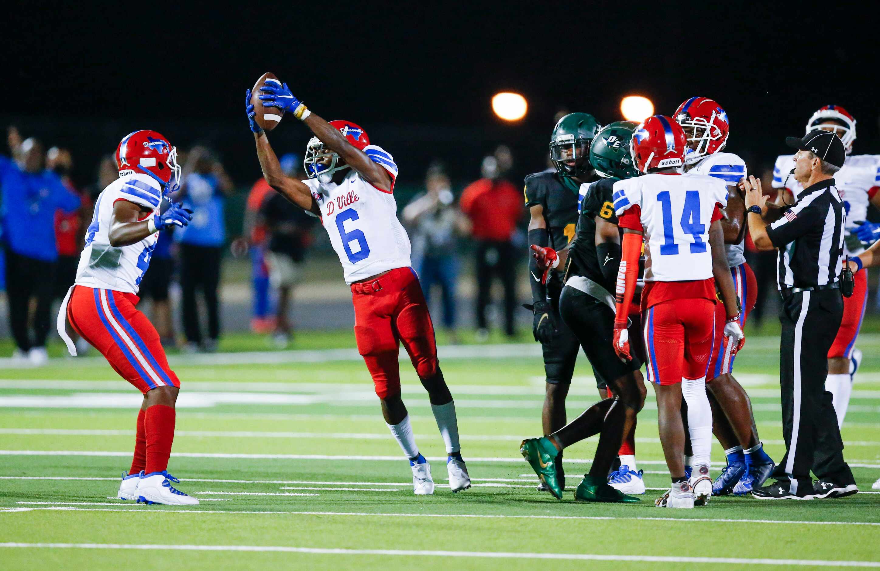 Duncanville senior Da’Myrion Colemman (6)(CQ) celebrates coming up with a DeSoto fumble on a...