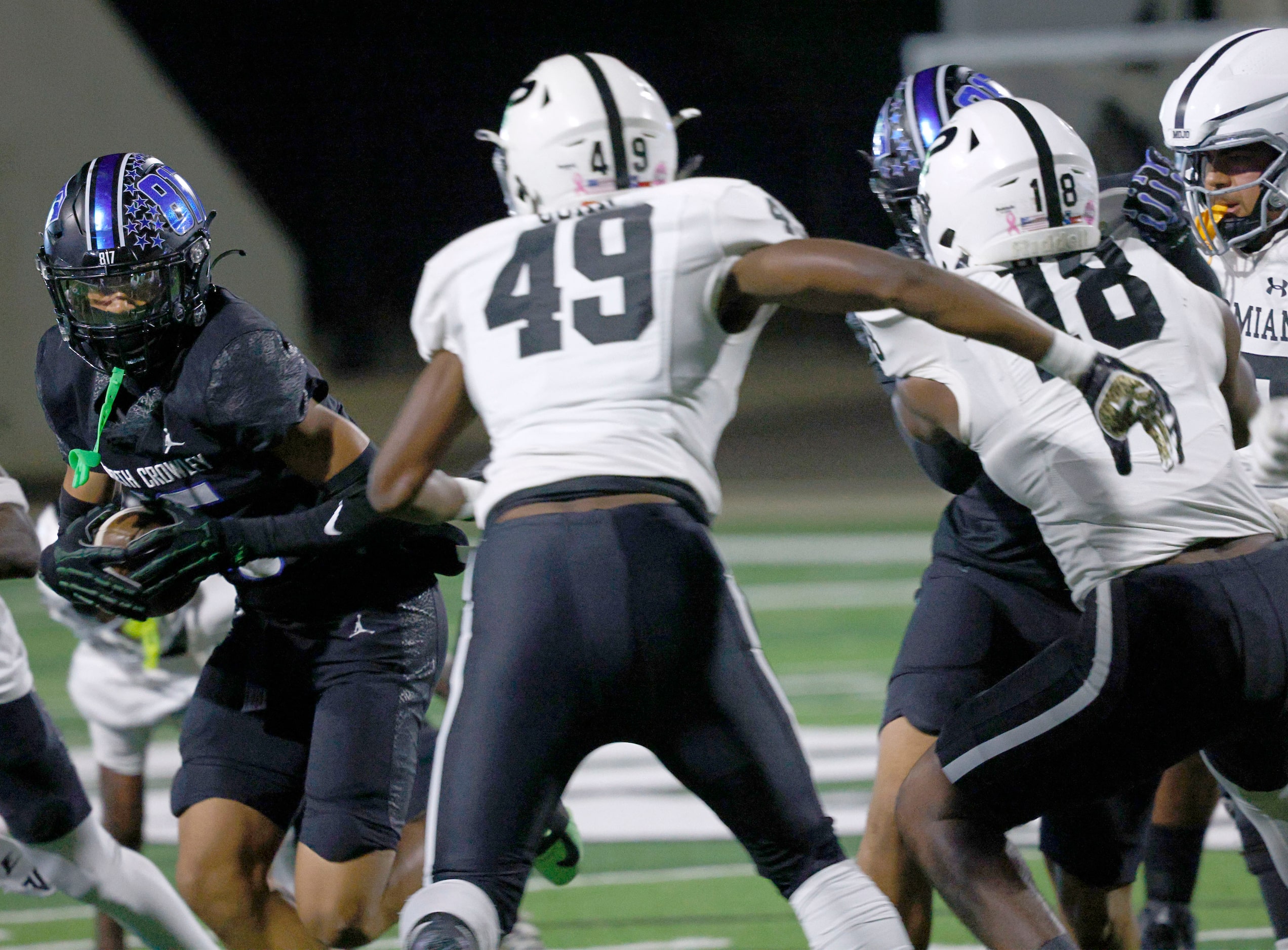 North Crowley's Elijajuan Houston (16) carries the ball against Permian and scores a...