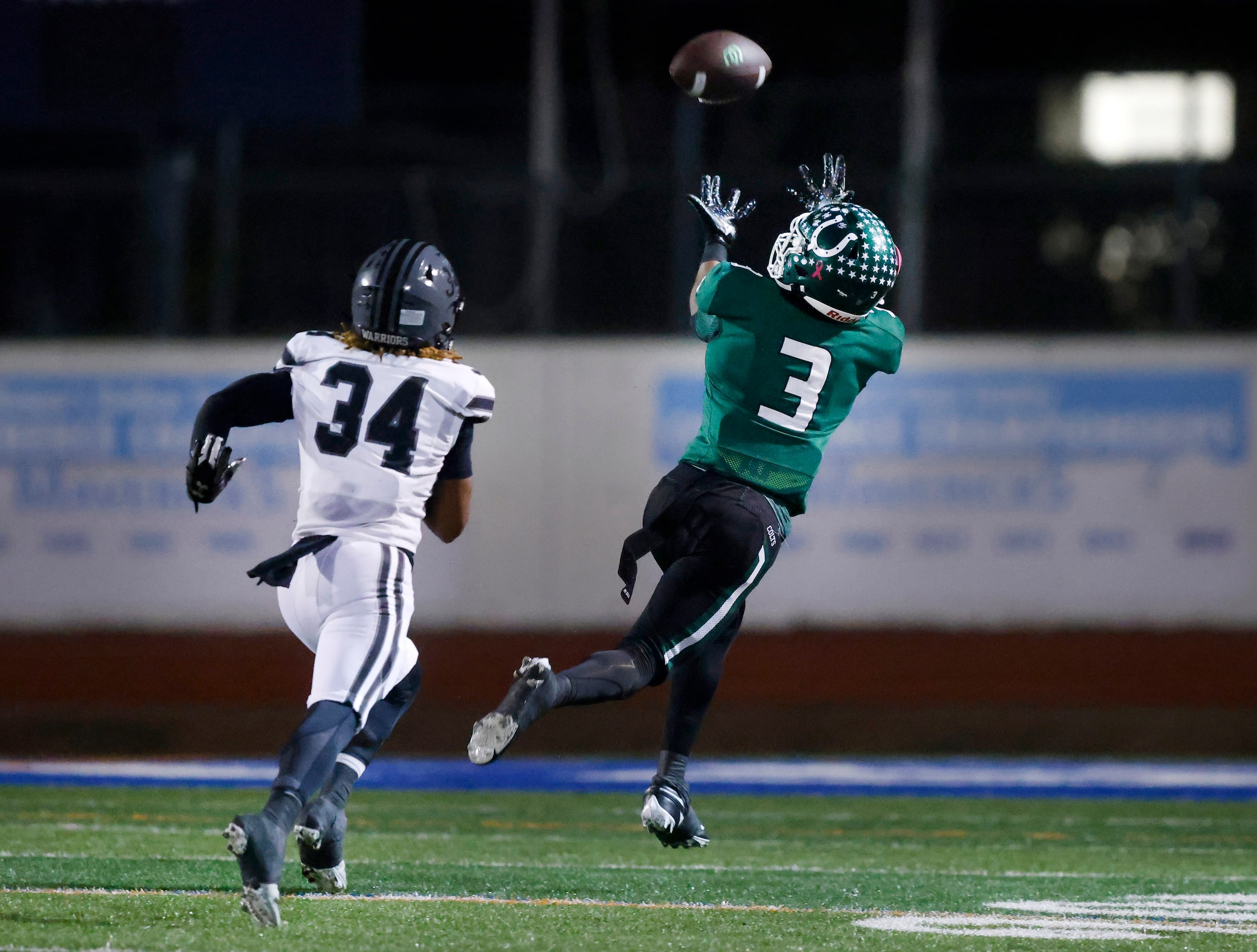 Arlington High receiver Tayshaun Goston pulls in a long touchdown pass in their 49-31 win...