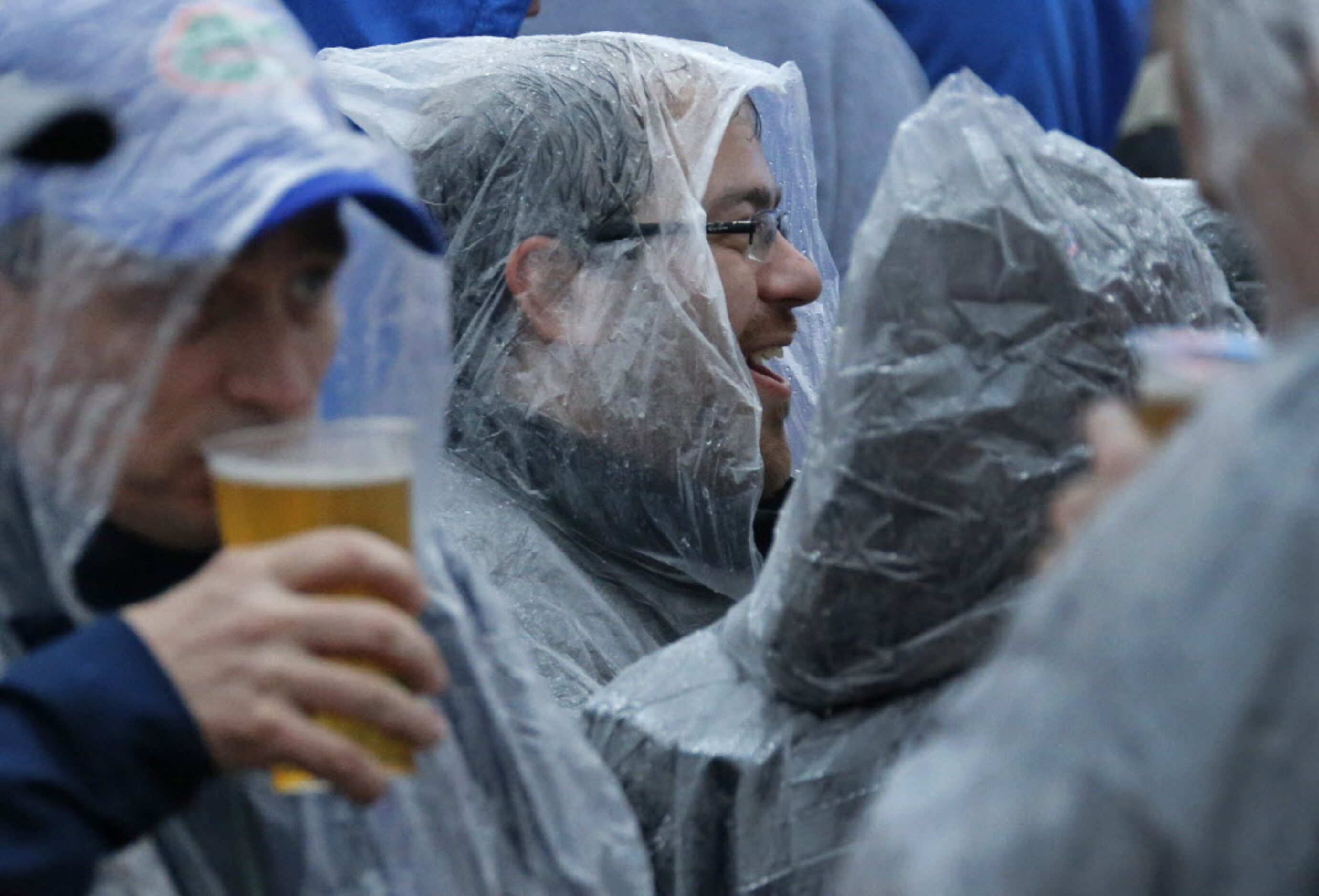 Some fans try to make the best of the situation as they wait for Bruce Springsteen to...