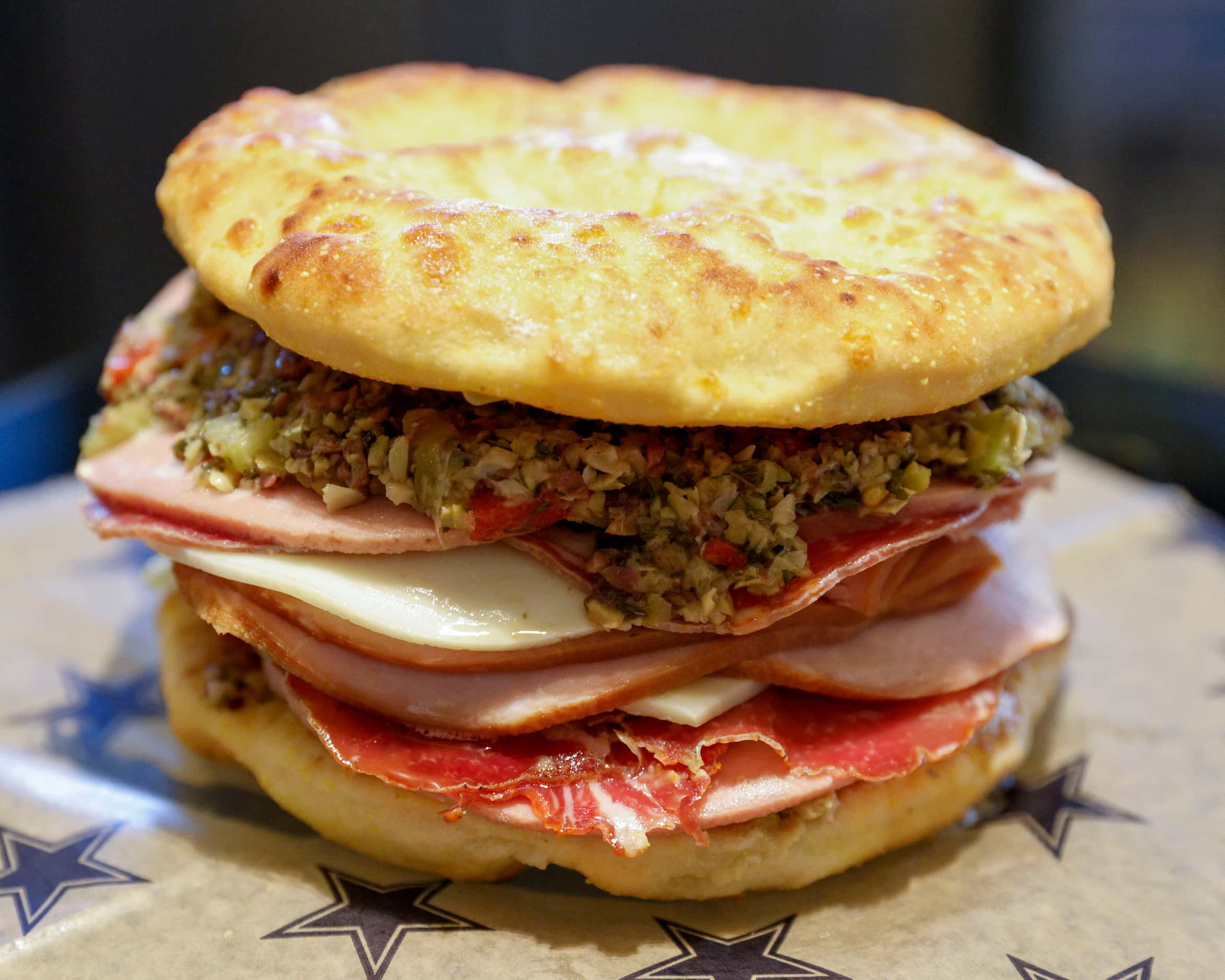Want a sandwich almost as big as your face? The muffuletta might be the answer. It's on the...