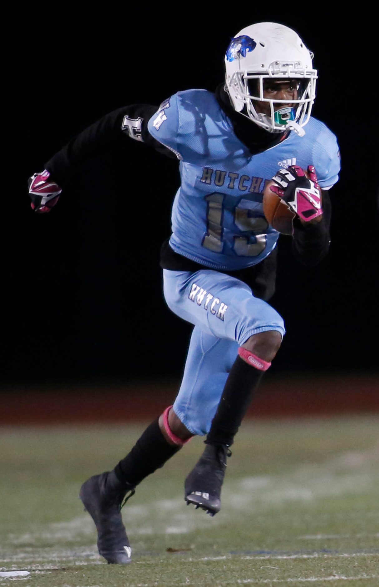 Wilmer Hutchins receiver Rodrick Tolbert (15) follows his blocks as he returns a first half...