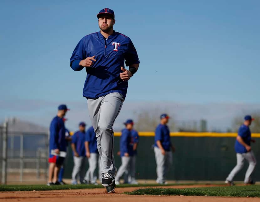 Texas Rangers third baseman Joey Gallo cross home plate while participating in base running...