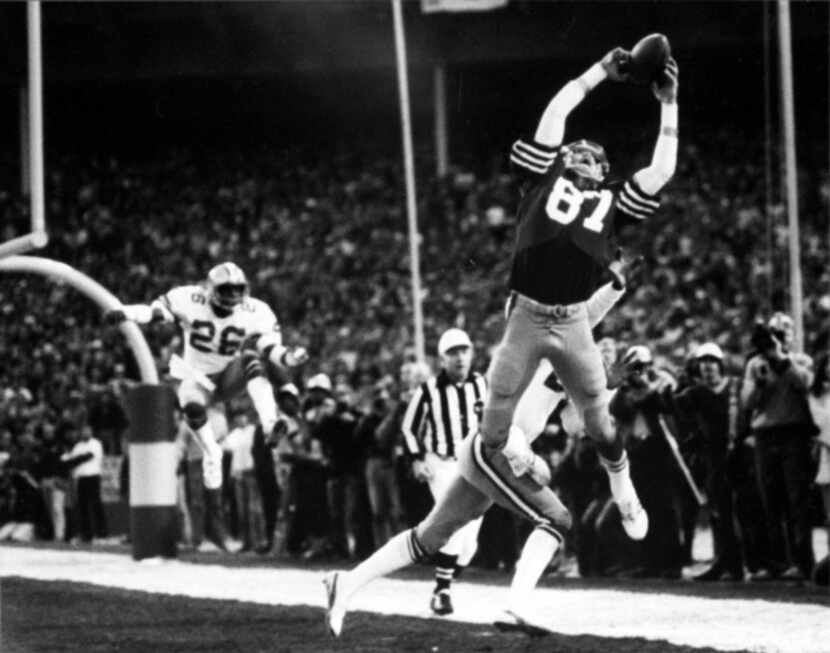"The Catch" - 49ers quarterback Joe Montana finds Dwight Clark, who cut across the back of...