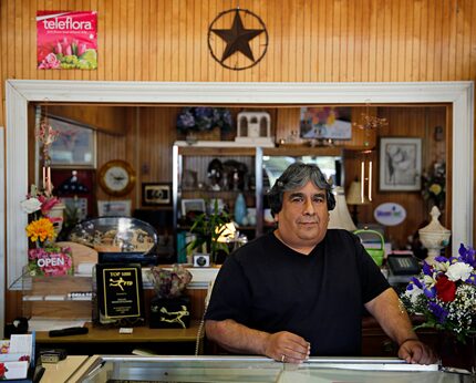 Larry Hernandez, co-owner of Dallas House of Flowers, helped fill many arrangements used in...