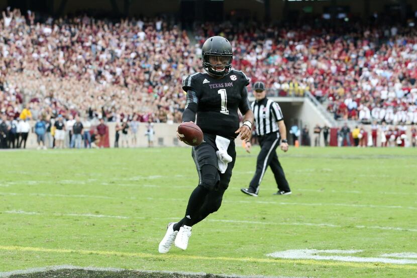 Texas A&M Aggies quarterback Kyler Murray (1) scores a touchdown off a run on a fourth down...