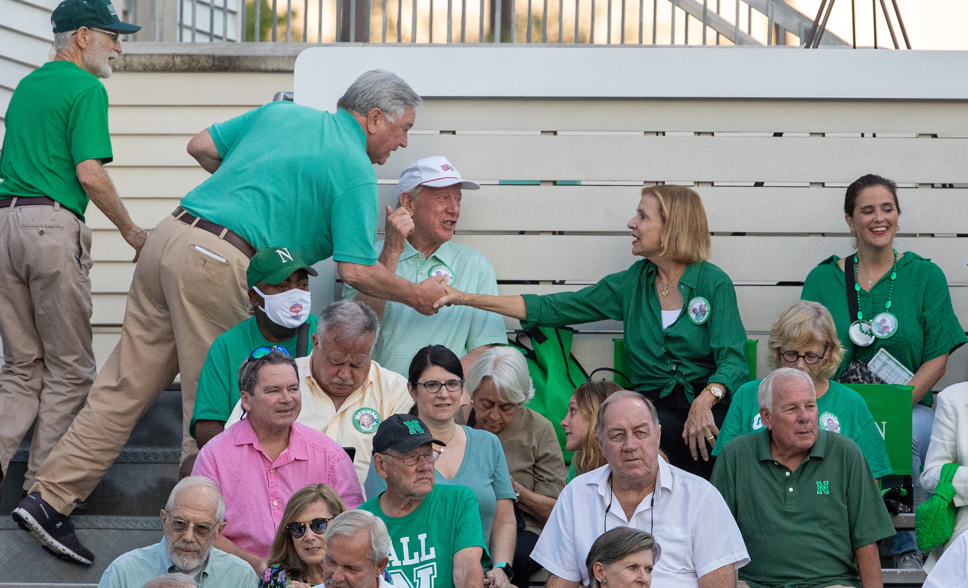 Archie and Olivia Manning greet friends in the stands as their grandson Arch Manning and...