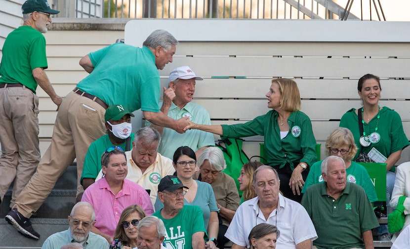 Archie and Olivia Manning greet friends in the stands as they watch their grandson, Arch...