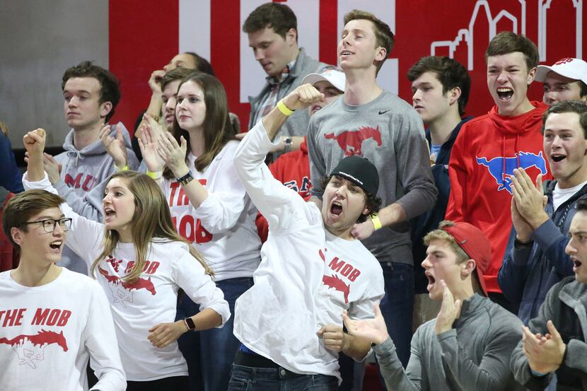The SMU Mustangs student section reacts to a play in the second half of an NCAA basketball...