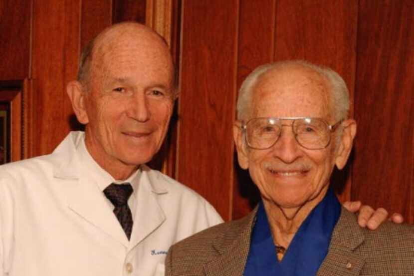Fitness expert Dr. Kenneth Cooper (left) with Masters runner Orville Rogers, a world record...