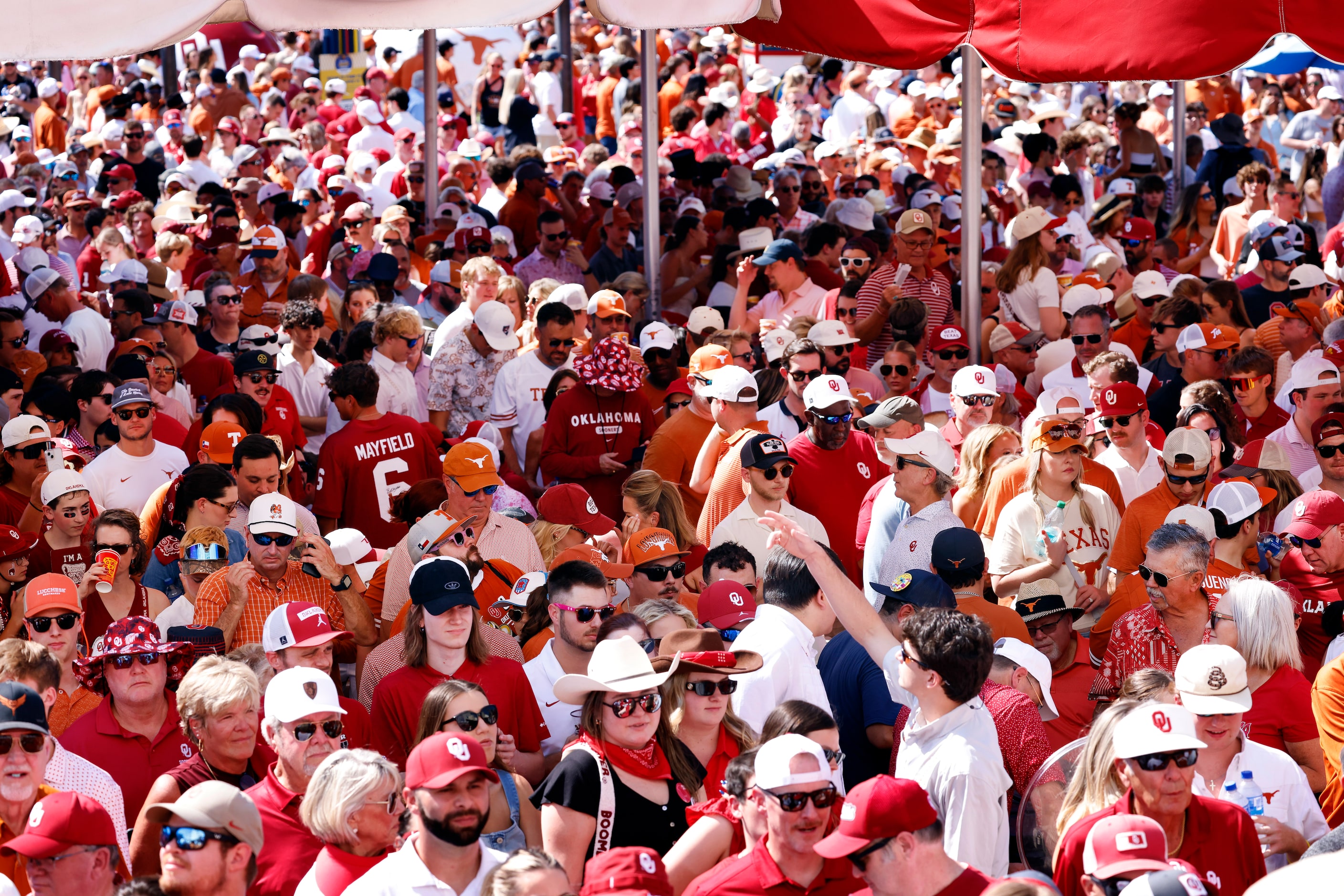 Texas Longhorns and Oklahoma Sooners fans arrive for the Red River Rivalry outside the...