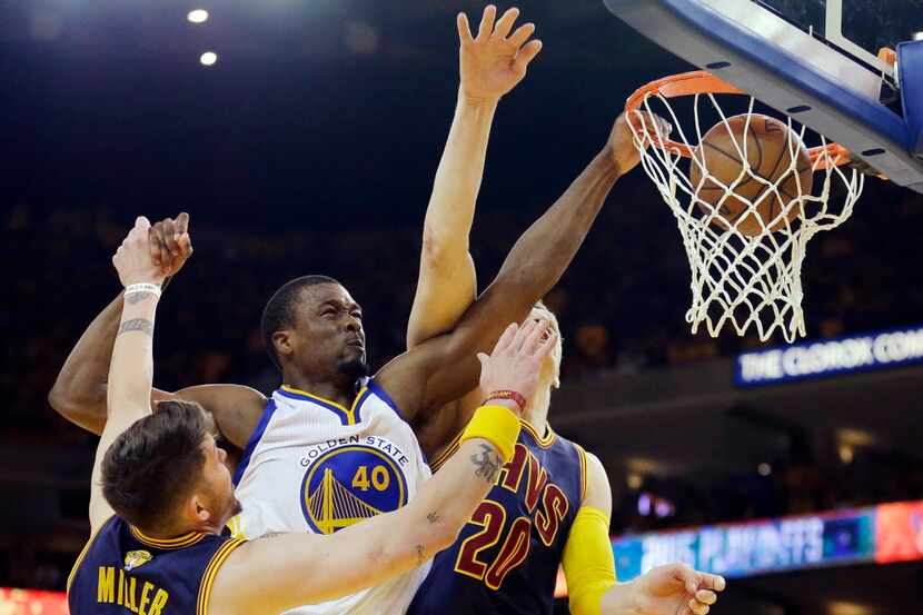 Golden State Warriors forward Harrison Barnes (40) dunks over Cleveland Cavaliers guard Mike...