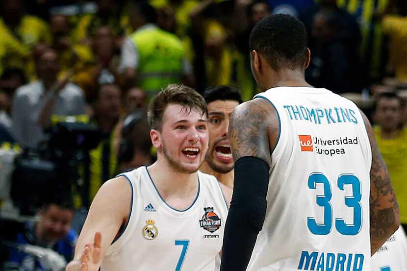 FILE - In this May 20, 2018, file photo, Real Madrid's Luka Doncic (7) reacts with teammate...