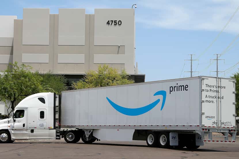 This file photo shows an Amazon shipping truck at a fulfillment center in Phoenix.