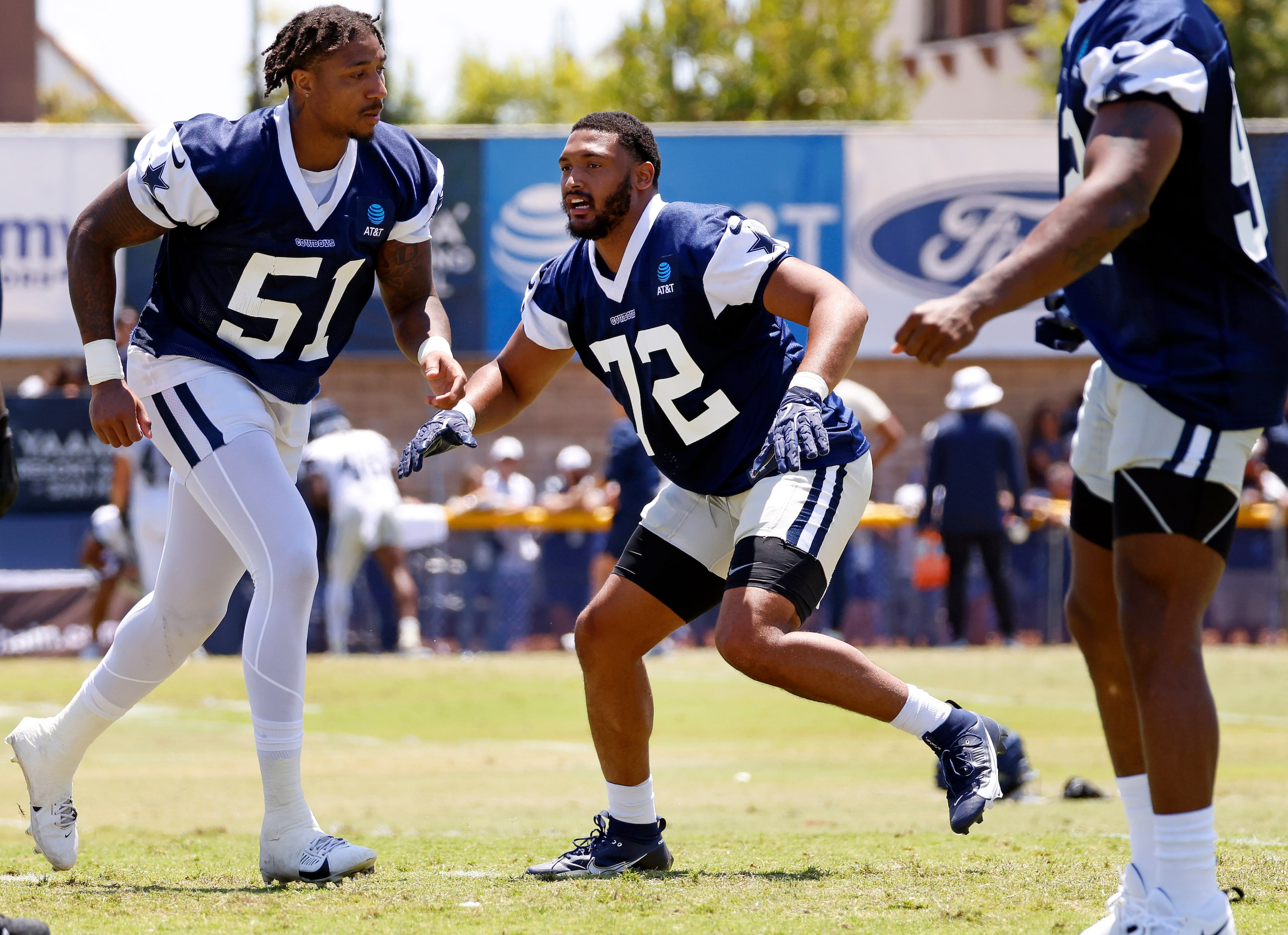 Dallas Cowboys newly singed defensive end Shaka Toney (72) and linebacker Byron Vaughns (52)...