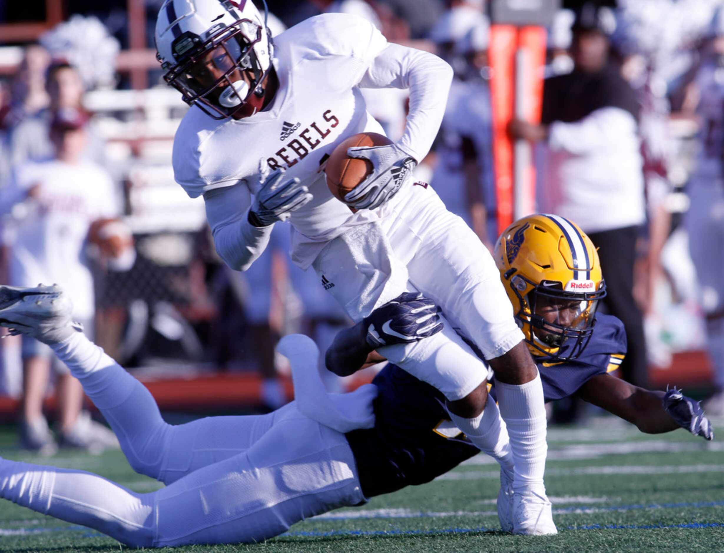 Arlington Lamar defensive back Harold West (10) tackles Midland Lee receiver Evan McMaryion...