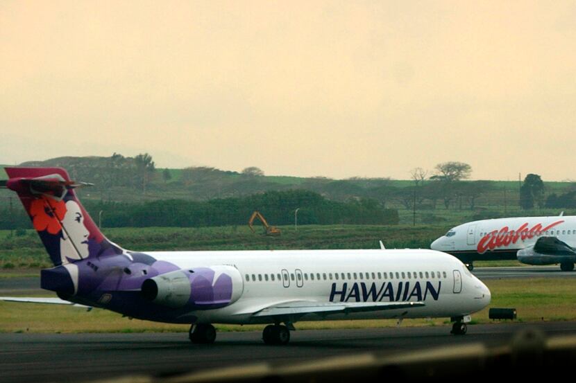 An Hawaiian Airlines plane taxis for position at Kahalui on the island of Maui.
