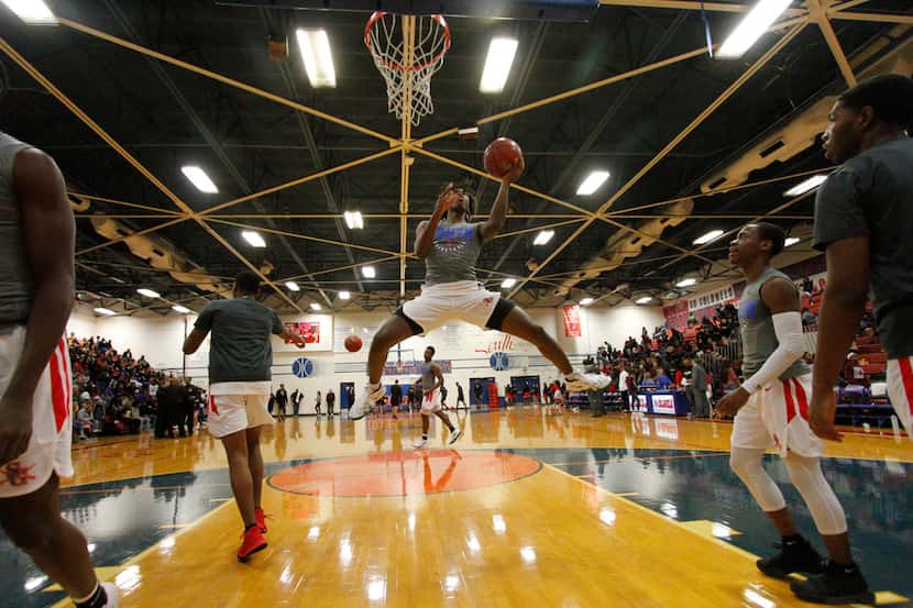 South Garland's Tyrese Maxey (3) flies to the basket during warm-ups with his teammates...