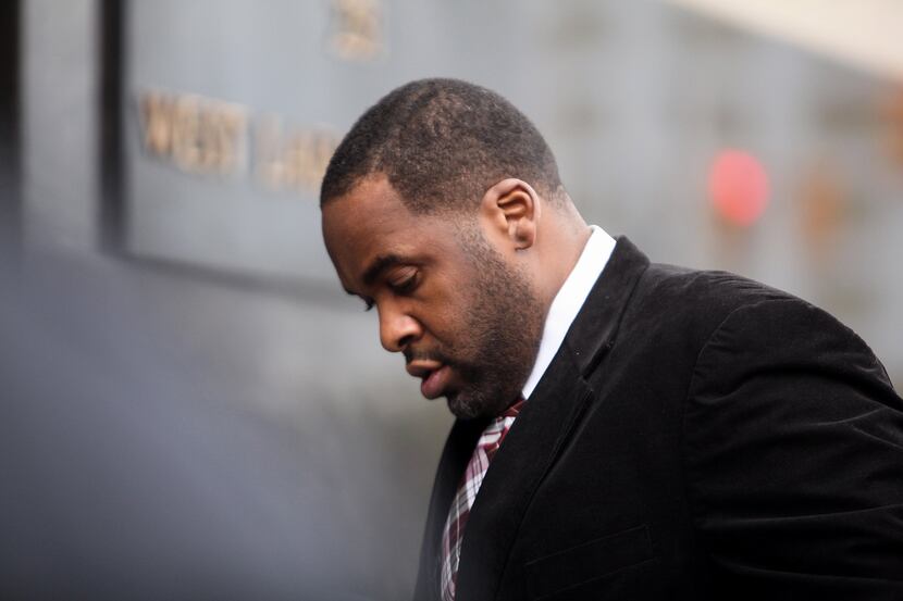 Former Detroit mayor Kwame Kilpatrick makes his way into federal court Monday in Detroit,...