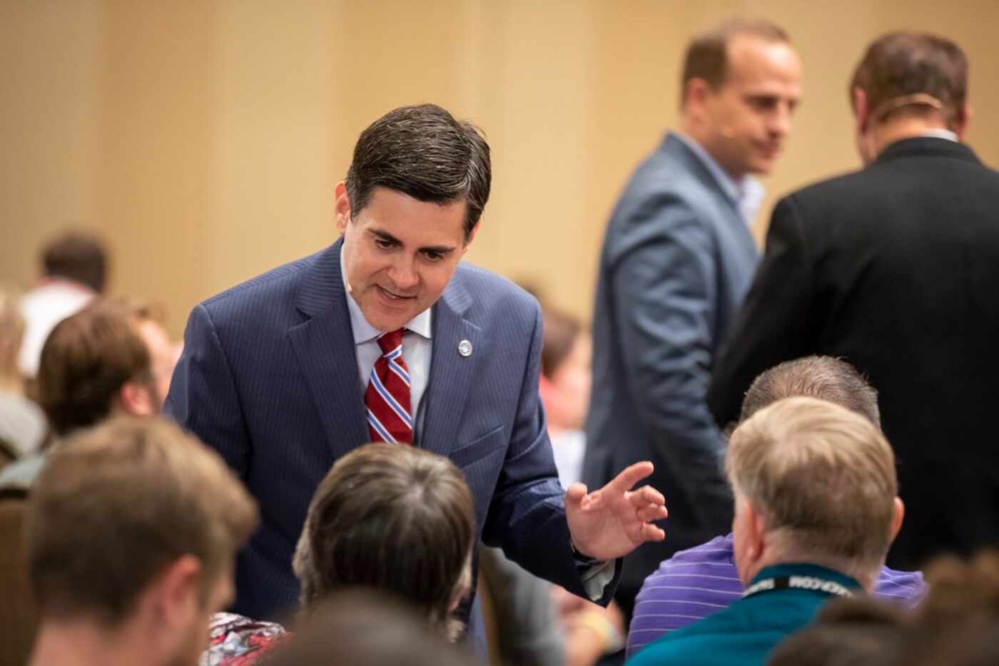 Russell Moore talks with people in the audience before a conversation on "Gospel Sexuality...