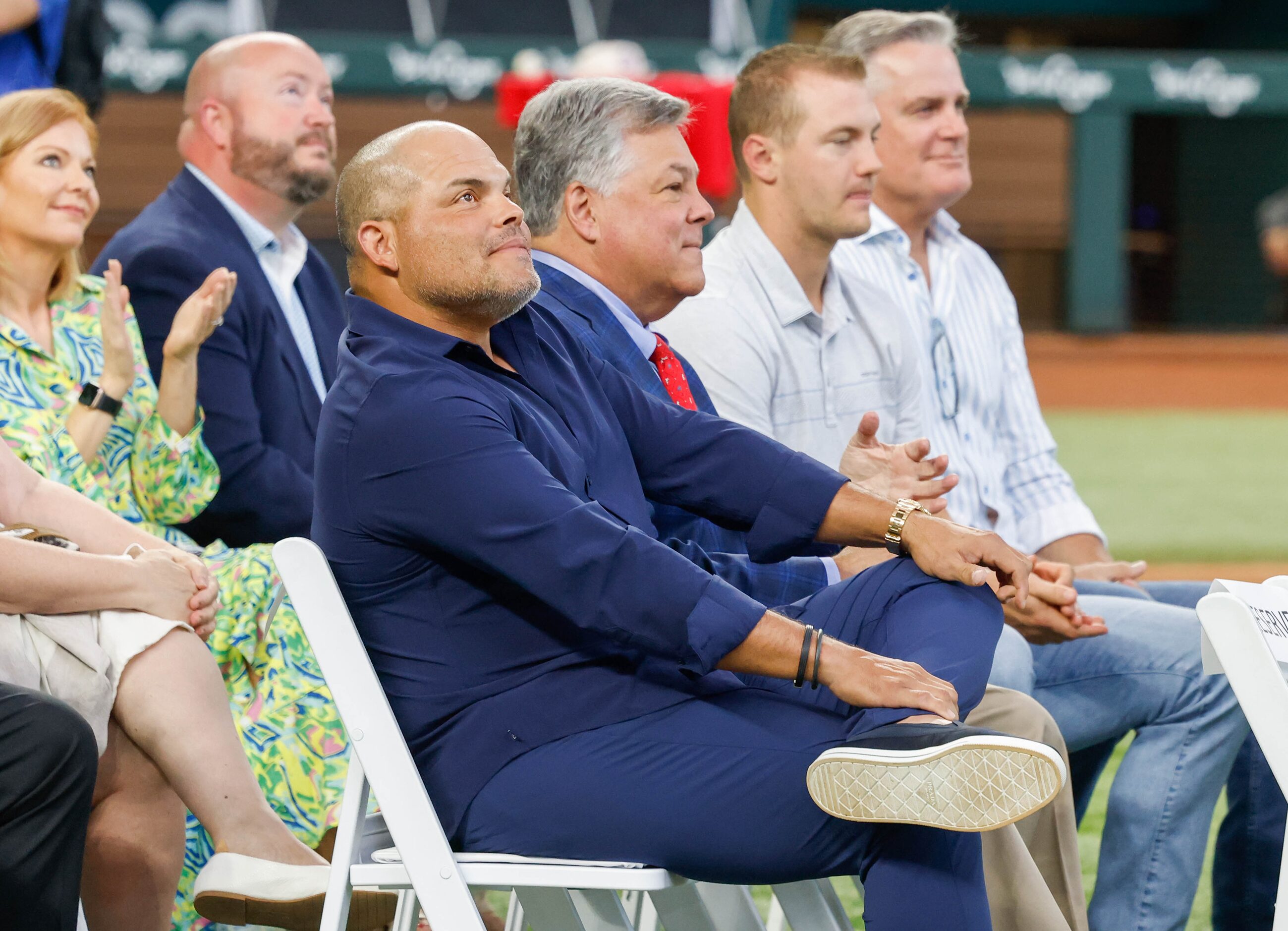 Texas Rangers Baseball Hall of Fame member Ivan 'Pudge' Rodriguez (front) looks up after...