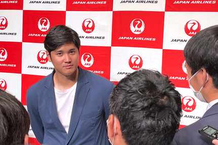 Los Angeles Angels' Shohei Ohtani speaks to reporters after he returned home, at the Haneda...
