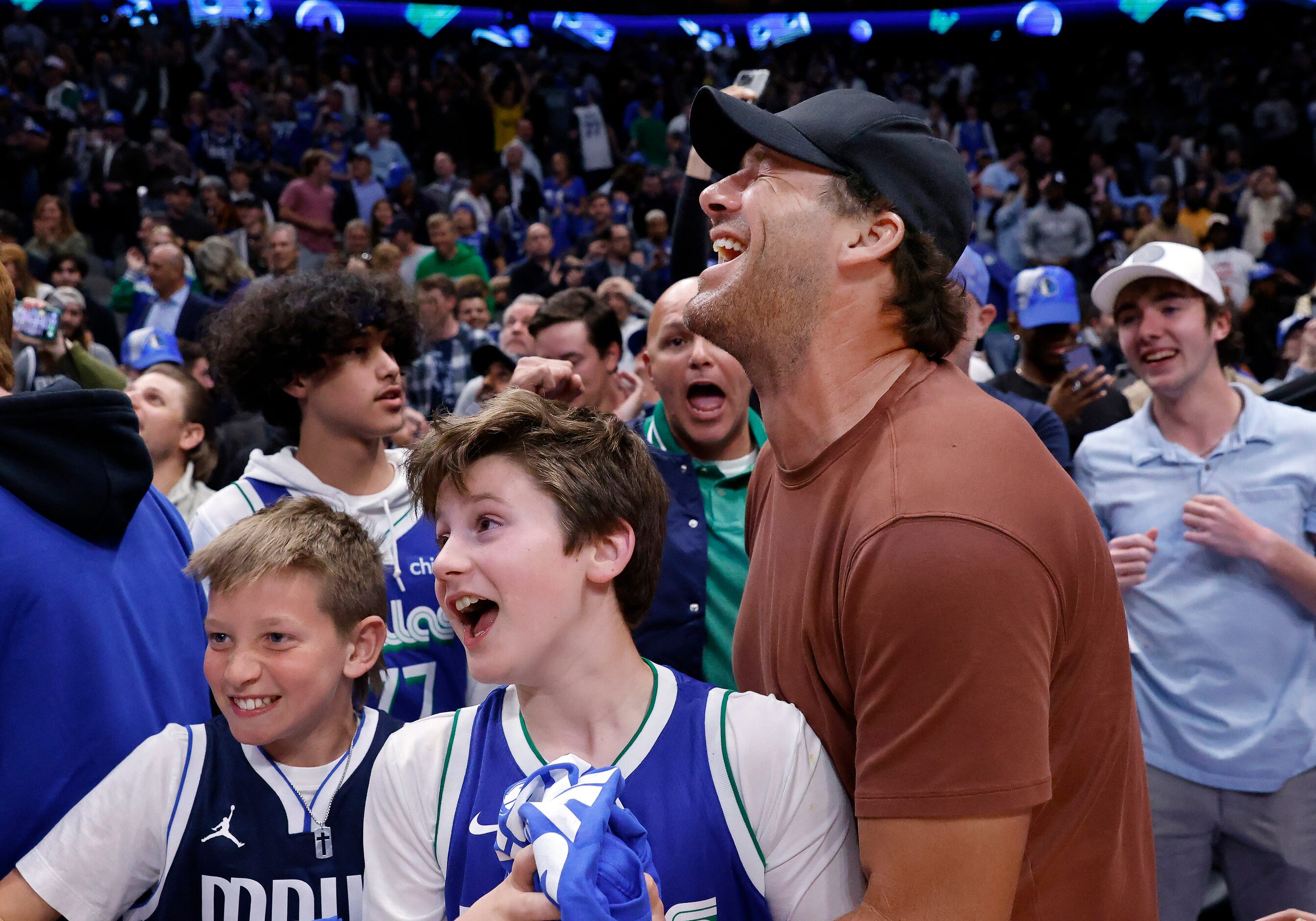 Former Dallas Cowboys quarterback Tony Romo celebrates the Dallas Mavericks win over the...