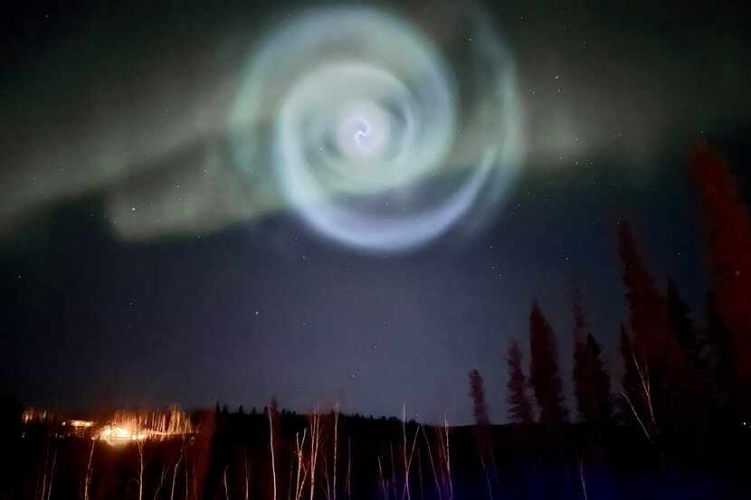 In this photo provided by Christopher Hayden, a light baby blue spiral resembling a galaxy...