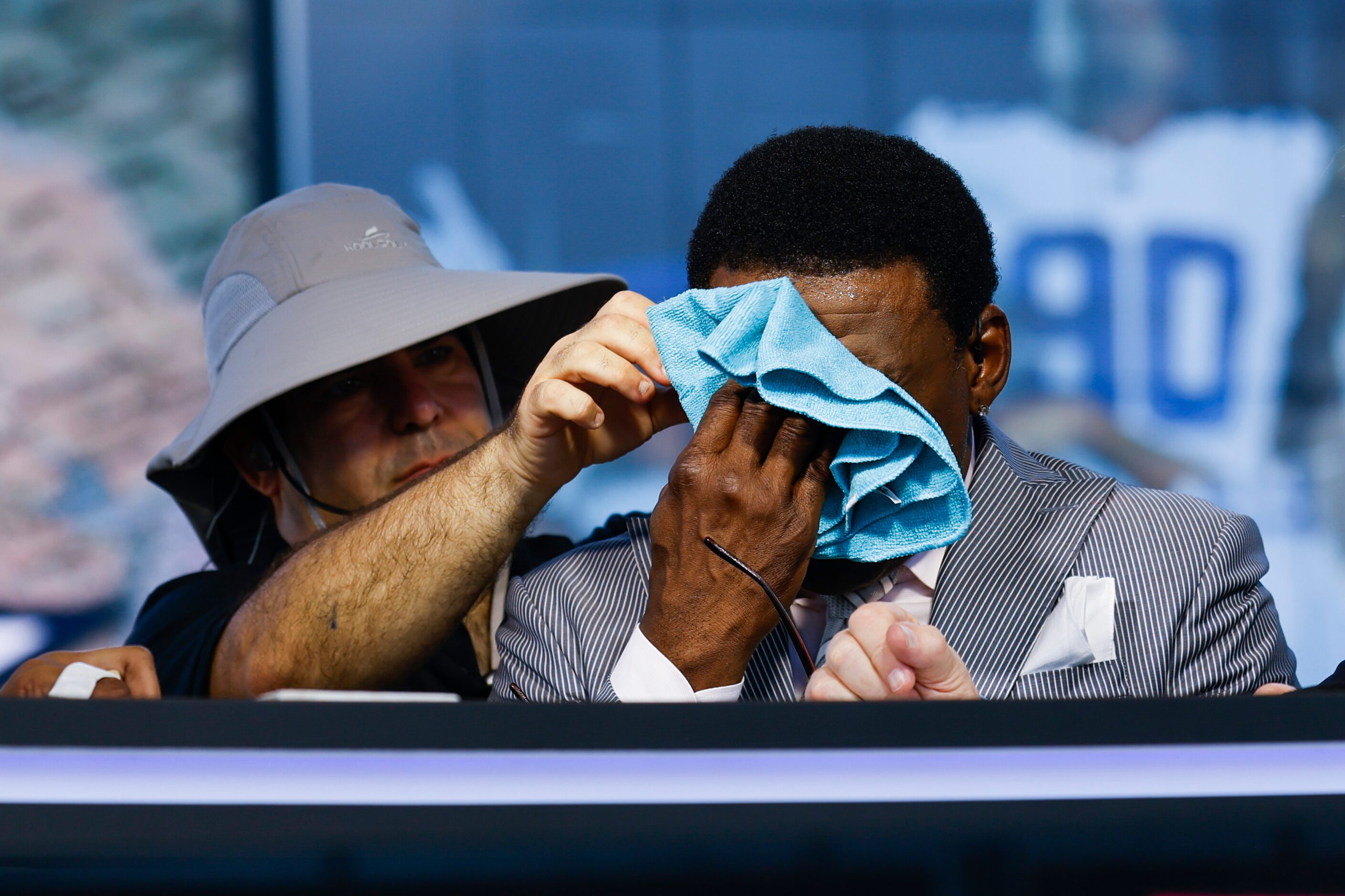 Former Dallas Cowboys player Michael Irvin cools off during a break of the recording of...