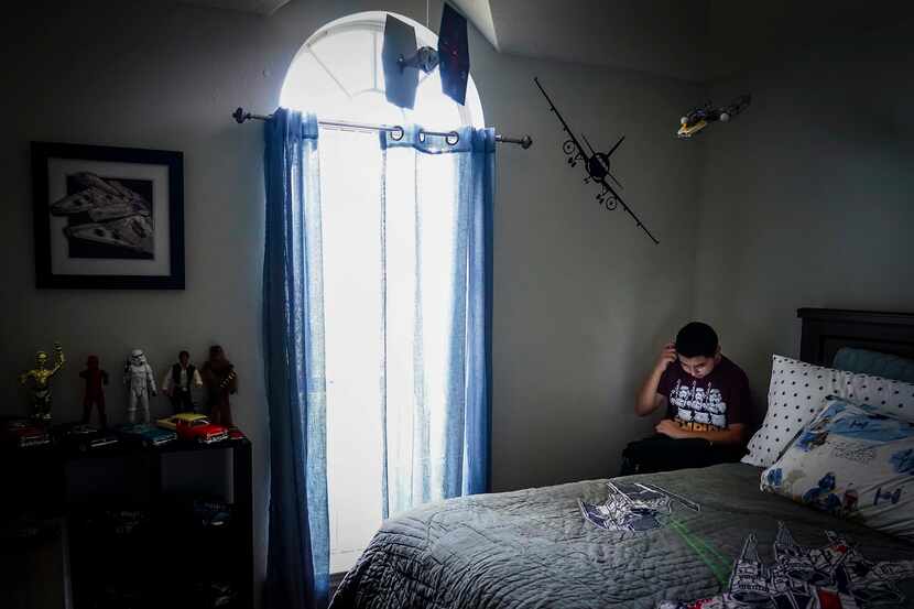 Francisco Cabrera, 13, did schoolwork for a math class on a computer in his bedroom at the...