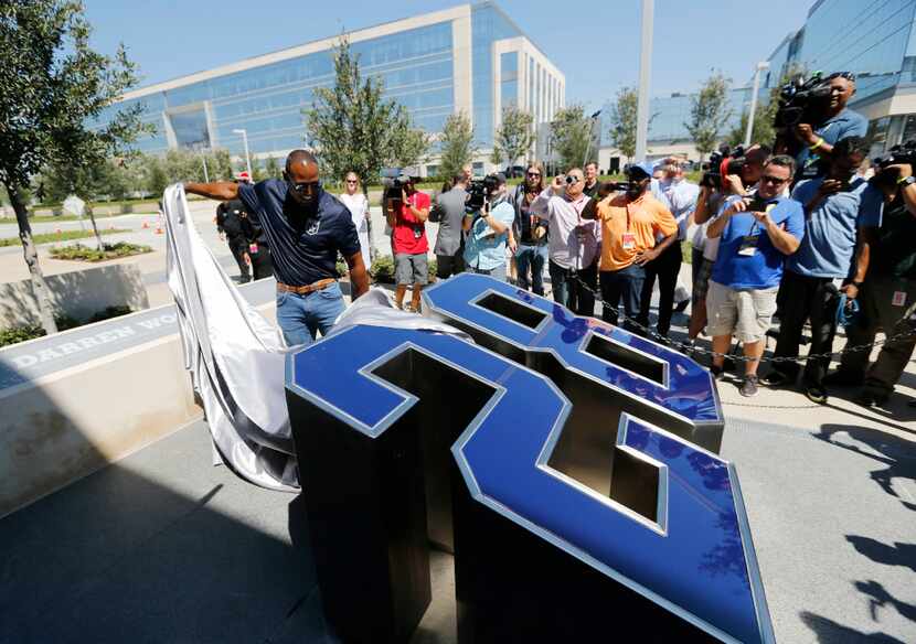Former Dallas Cowboys safety Darren Woodson unveils his number in his dedicated area during...