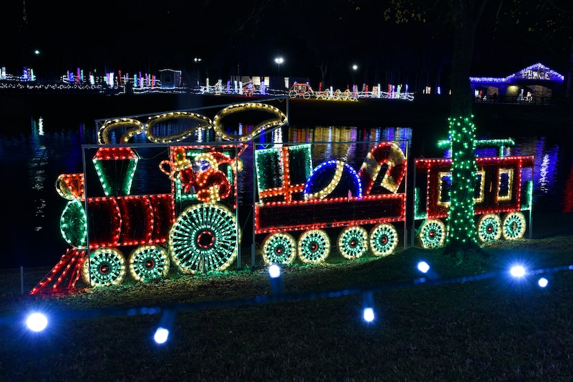 A Santa Claus train and other Christmas-themed light displays decorate the banks of Delaware...