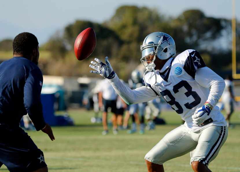Dallas Cowboys wide receiver Terrance Williams (83) works on his ball handling skills by...