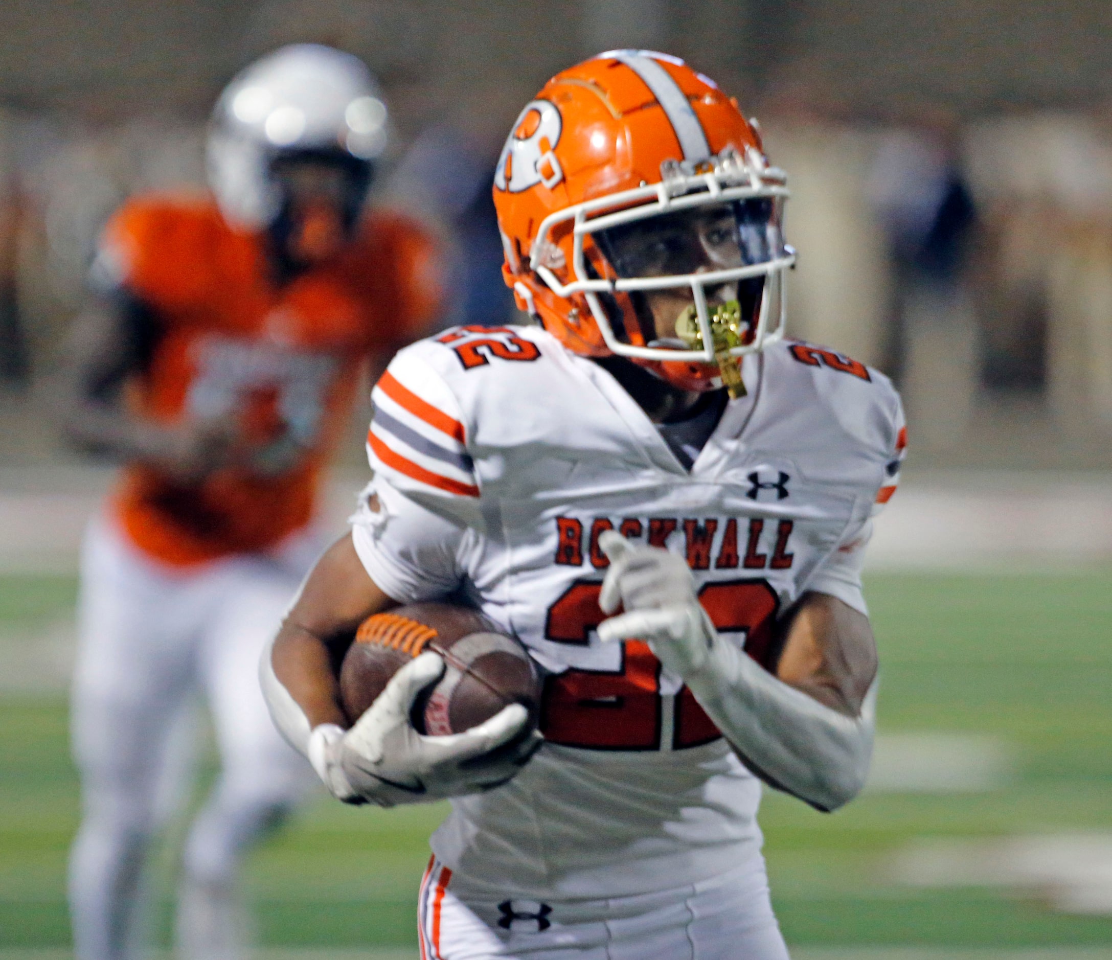 Rockwall High’s AJ Hatcher (22) is all alone, as runs with the ball during the first half of...