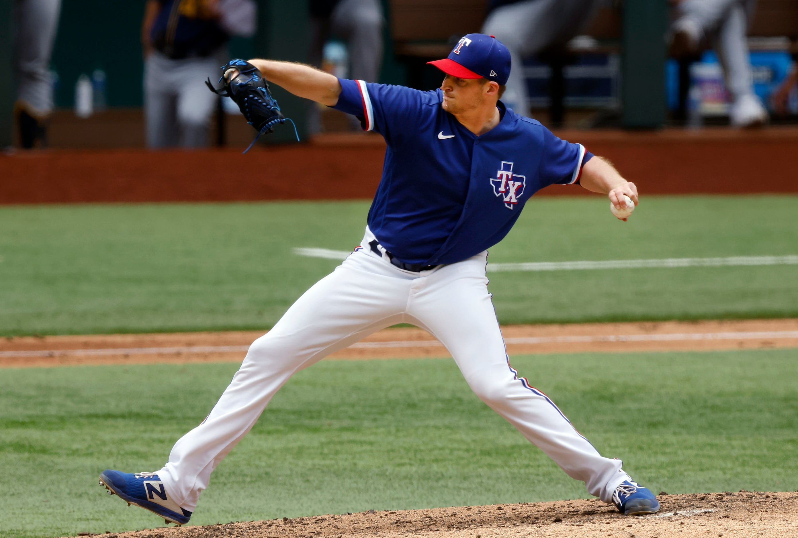 Texas Rangers relief pitcher Wes Benjamin (63) throws against the Milwaukee Brewers in the...
