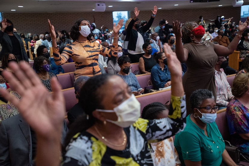 St. Luke members Debra Richardson (bottom center), Mavis Lloyd (left, wearing orange) and...