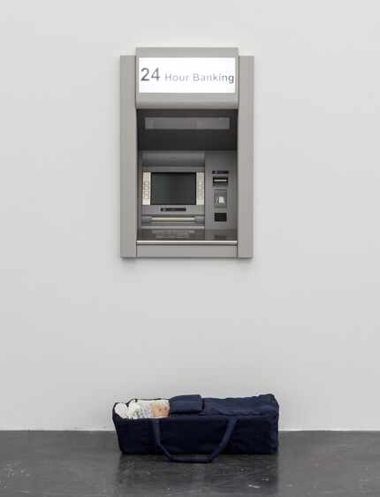 Modern Moses
combines an ATM with a baby carrier. 