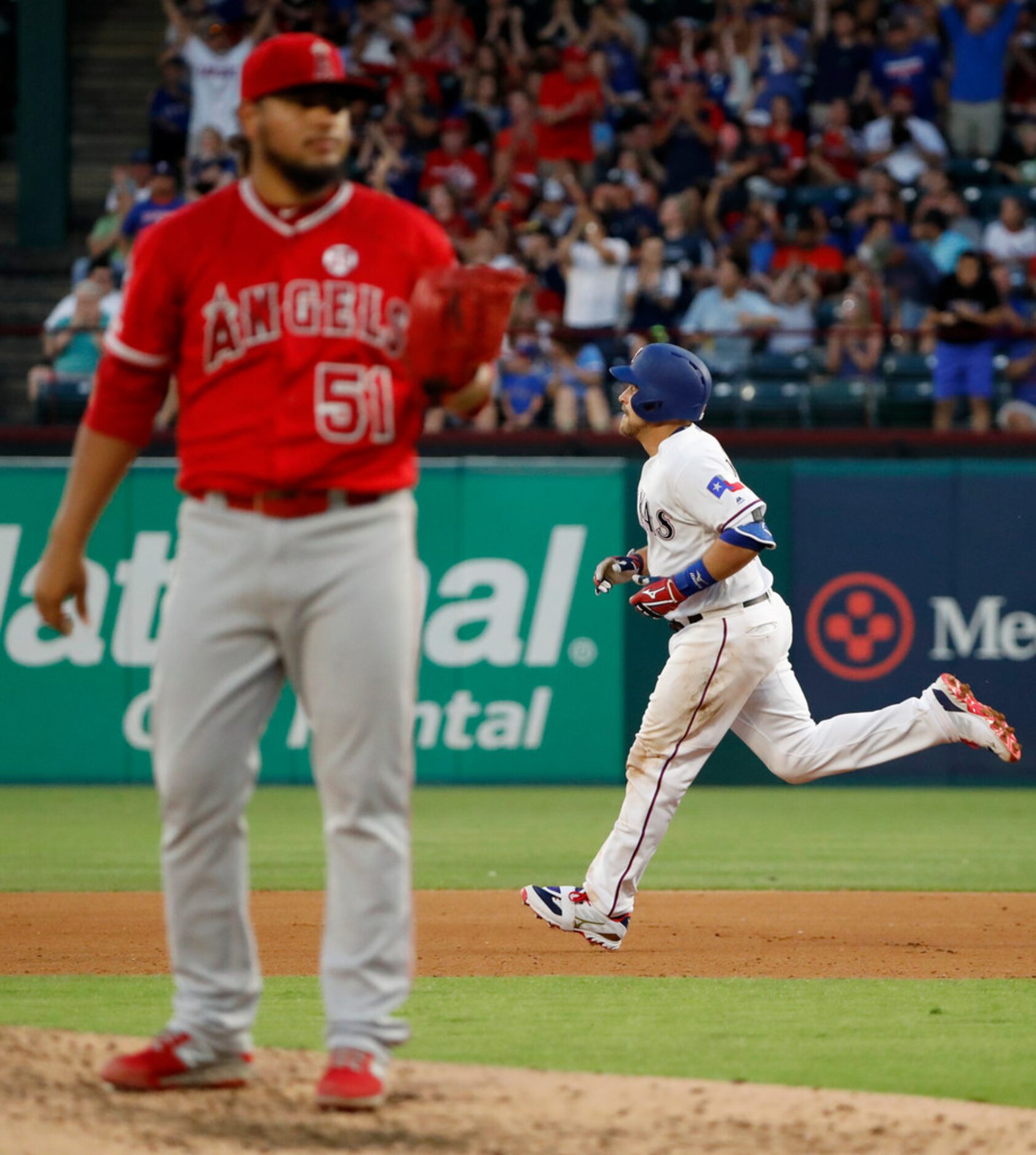 Los Angeles Angels starting pitcher Jaime Barria (51) stands on the mound as Texas Rangers'...